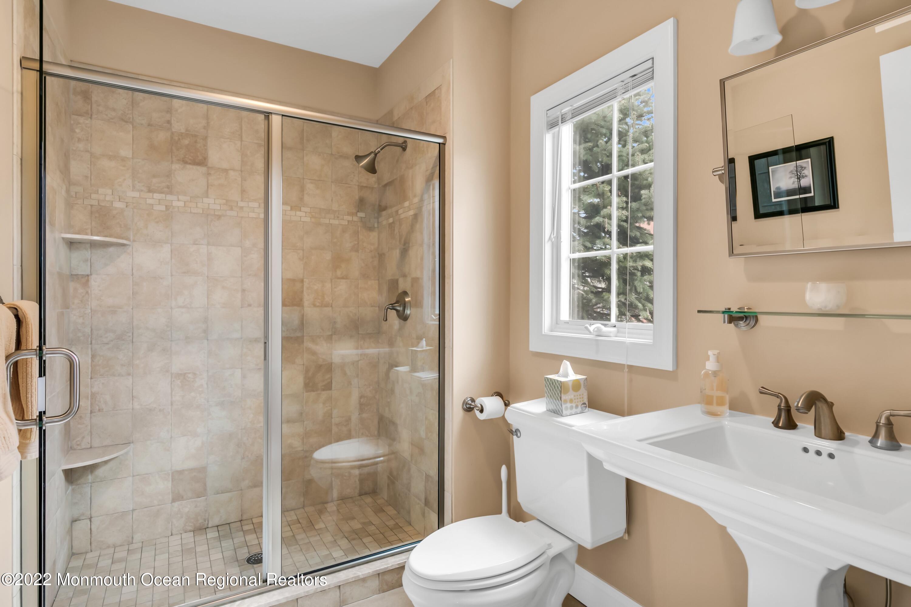 574 Harbor Road Brick, NJ 08724 - Photo 38 of 65 a bathroom with a sink toilet and shower