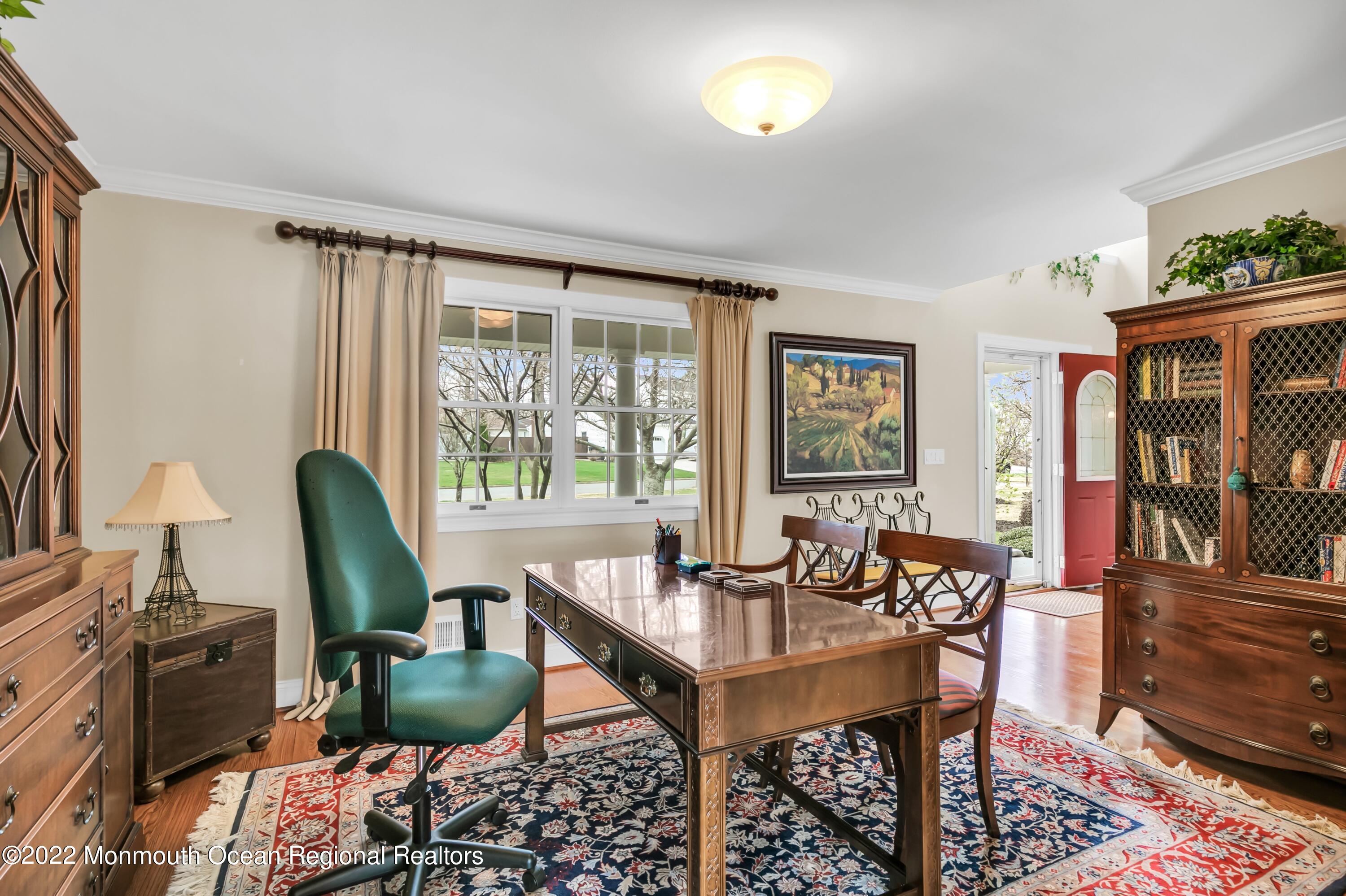 574 Harbor Road Brick, NJ 08724 - Photo 40 of 65 a dining room with furniture a window and wooden floor