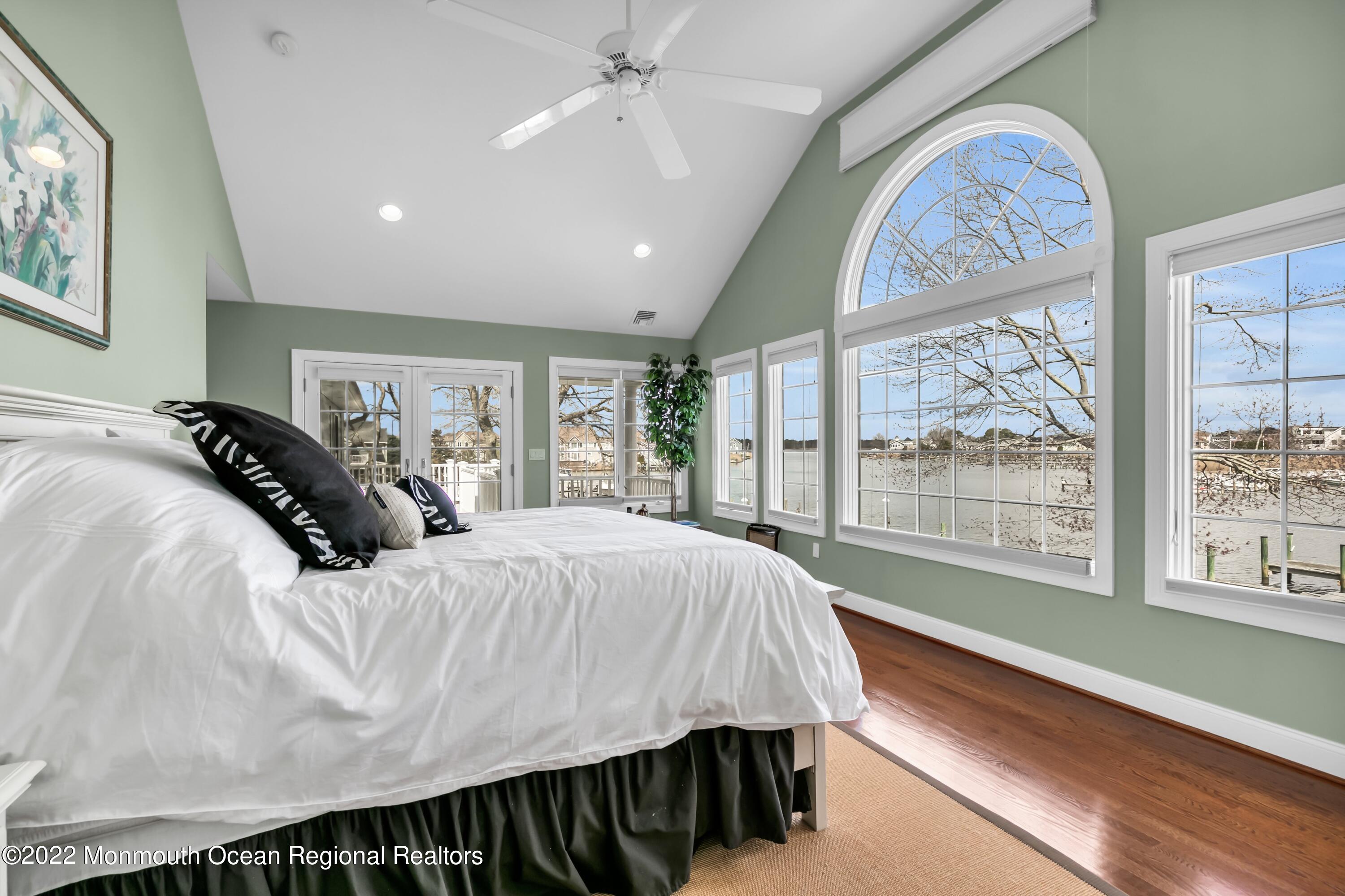 574 Harbor Road Brick, NJ 08724 - Photo 44 of 65 a bed sitting in a spacious bedroom next to a window