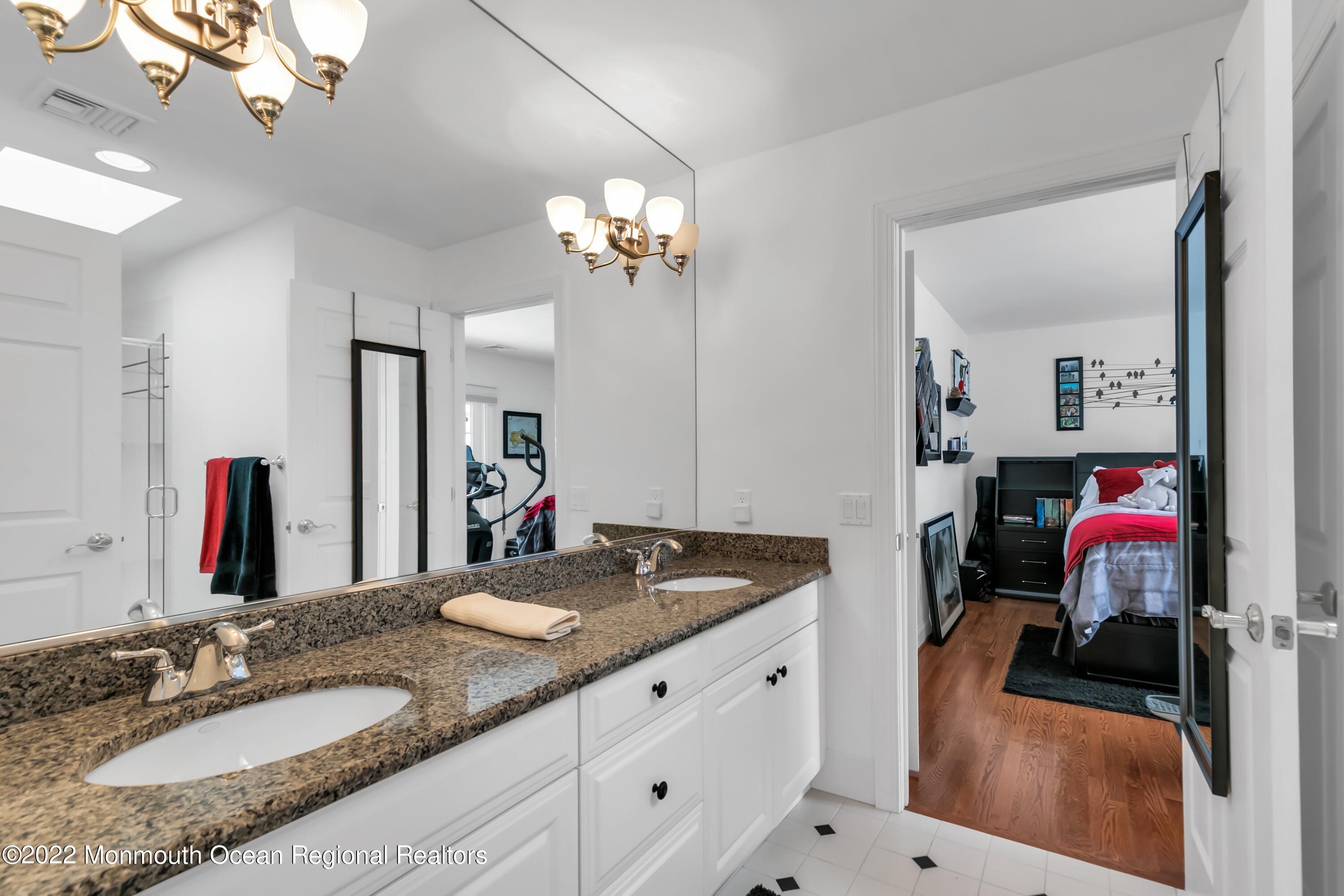 574 Harbor Road Brick, NJ 08724 - Photo 48 of 65 a bathroom with a sink double vanity and a mirror