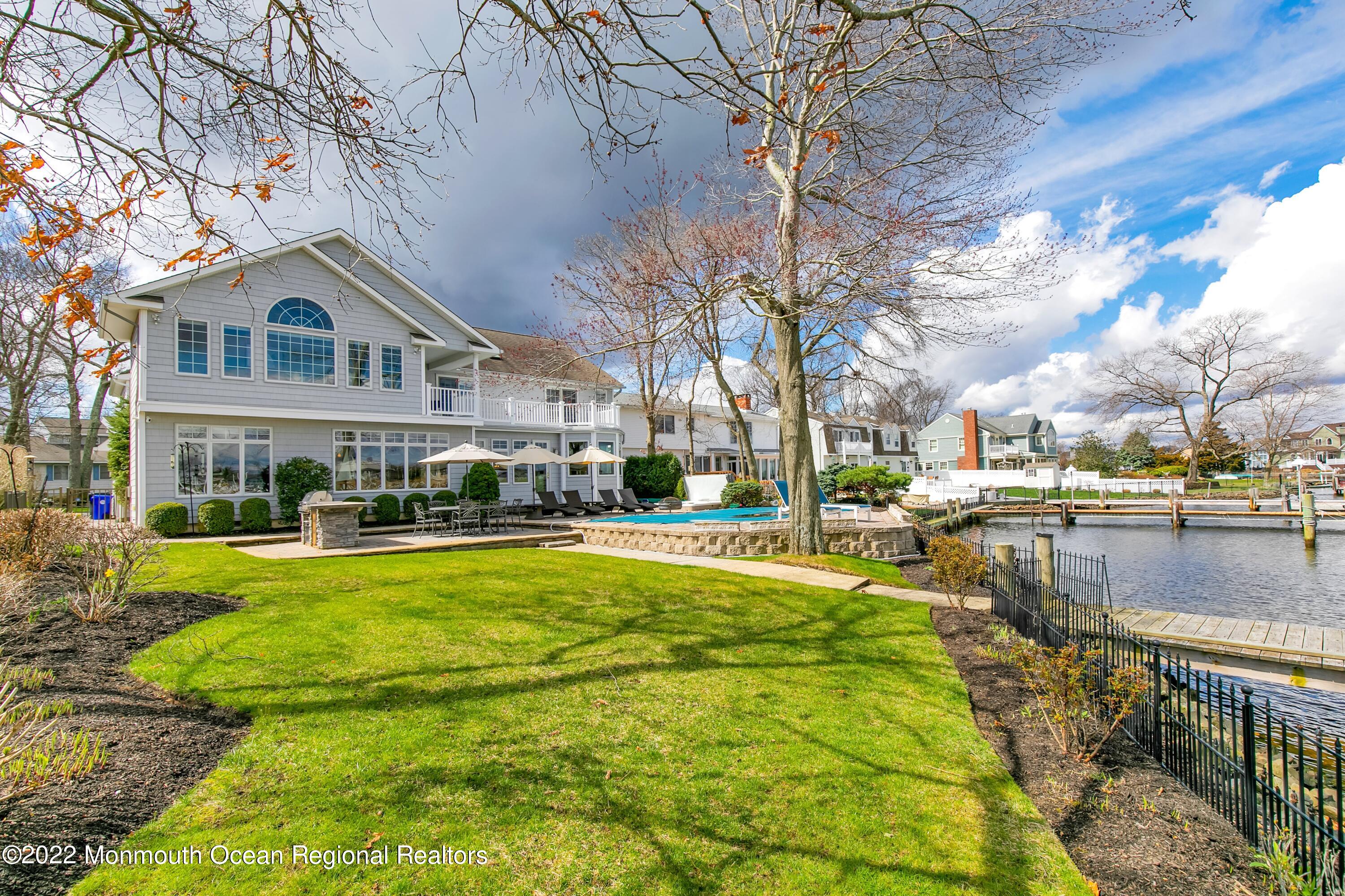 574 Harbor Road Brick, NJ 08724 - Photo 55 of 65 a front view of a house with swimming pool having outdoor seating