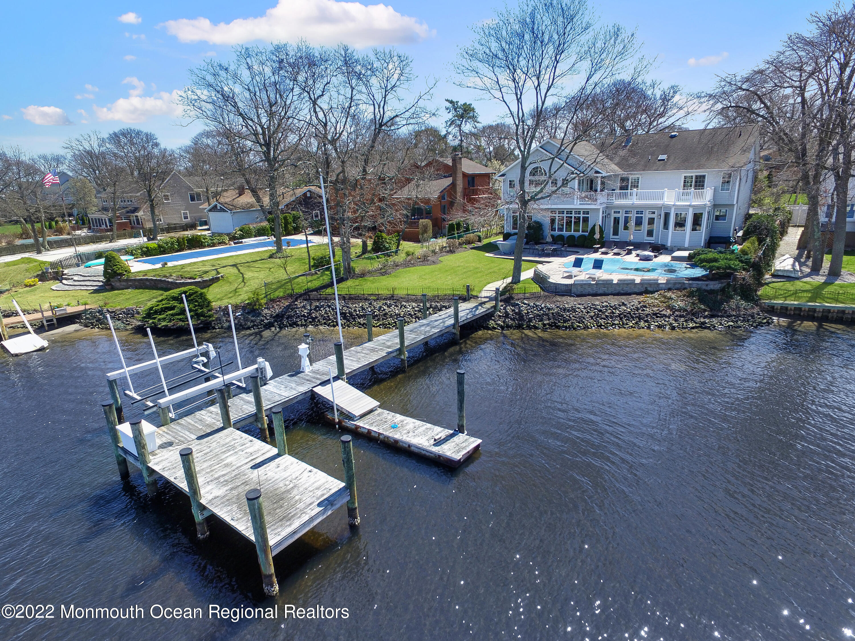574 Harbor Road Brick, NJ 08724 - Photo 60 of 65 a view of a patio with table and chairs with wooden floor and fence