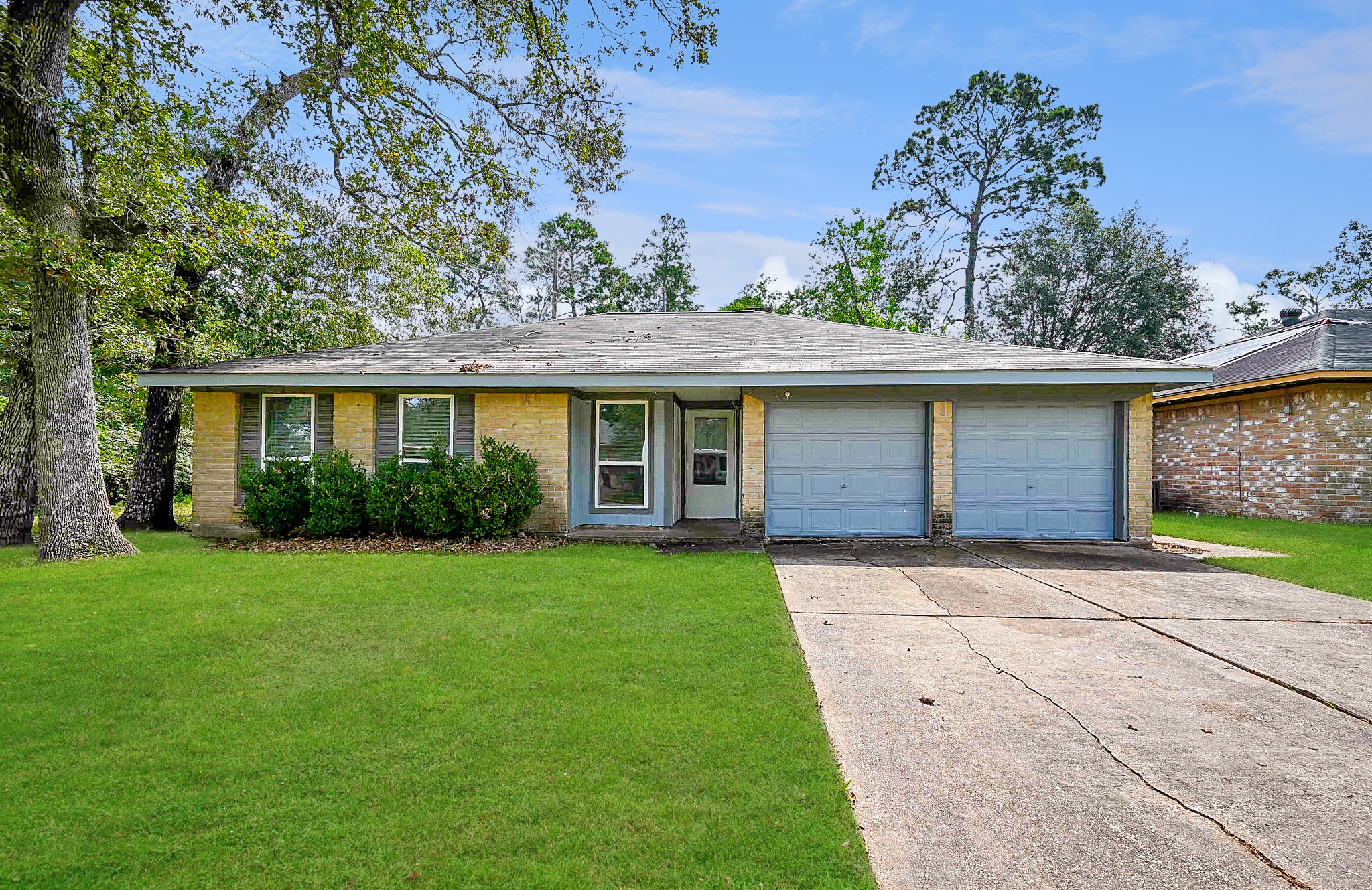 front view of a house with a yard