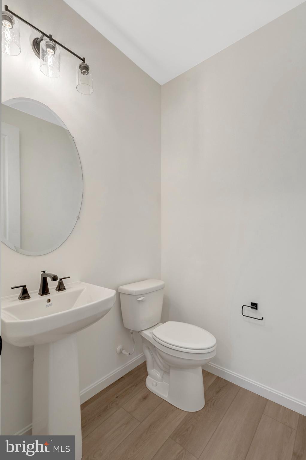 1925 Sunset Lane Culpeper, VA 22701 - Photo 12 of 74 a white toilet sitting next to a bathroom sink