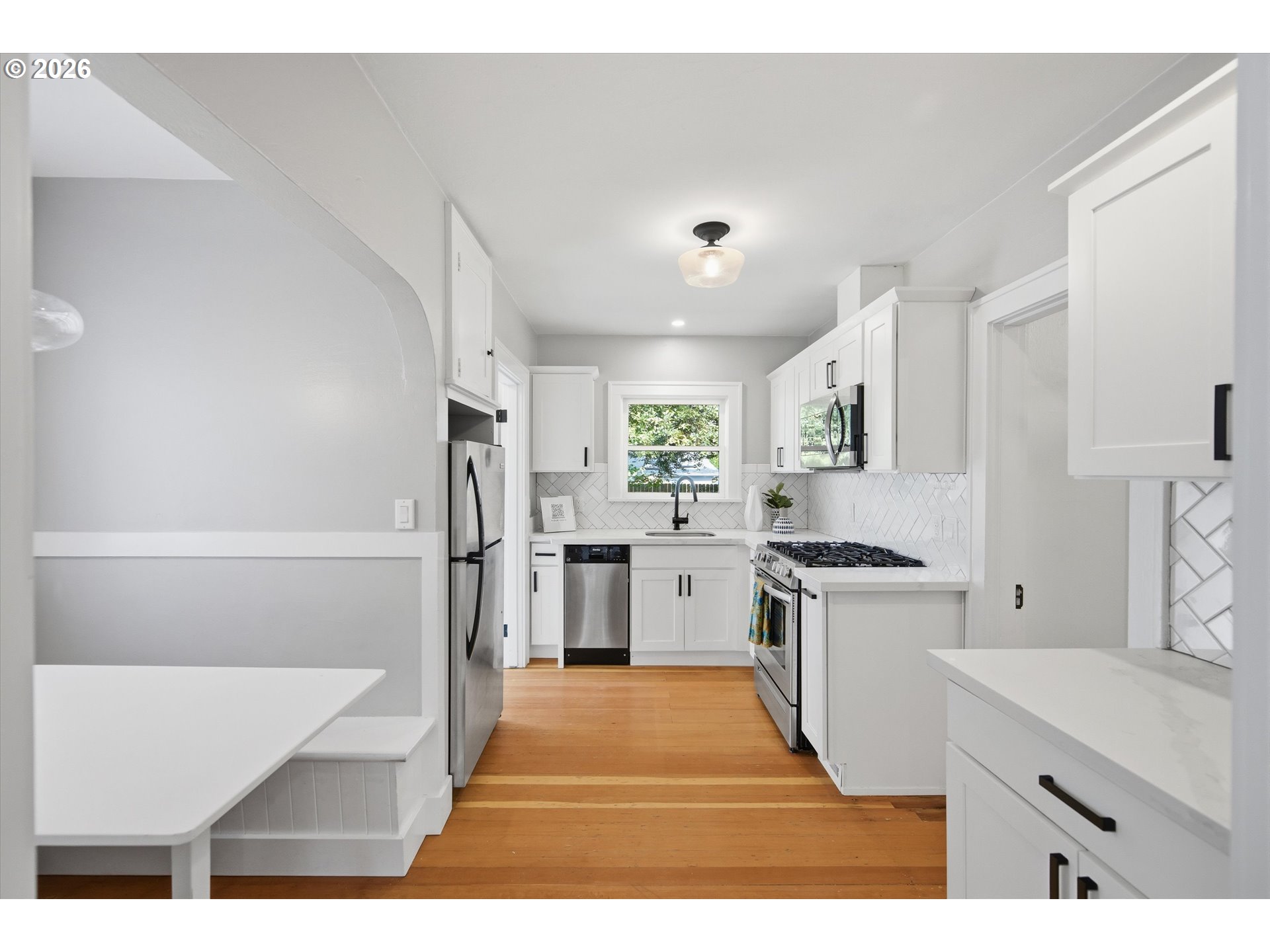 1934 Northeast 55th Avenue Portland, OR 97213 - Photo 11 of 23 a kitchen with white cabinets and refrigerator