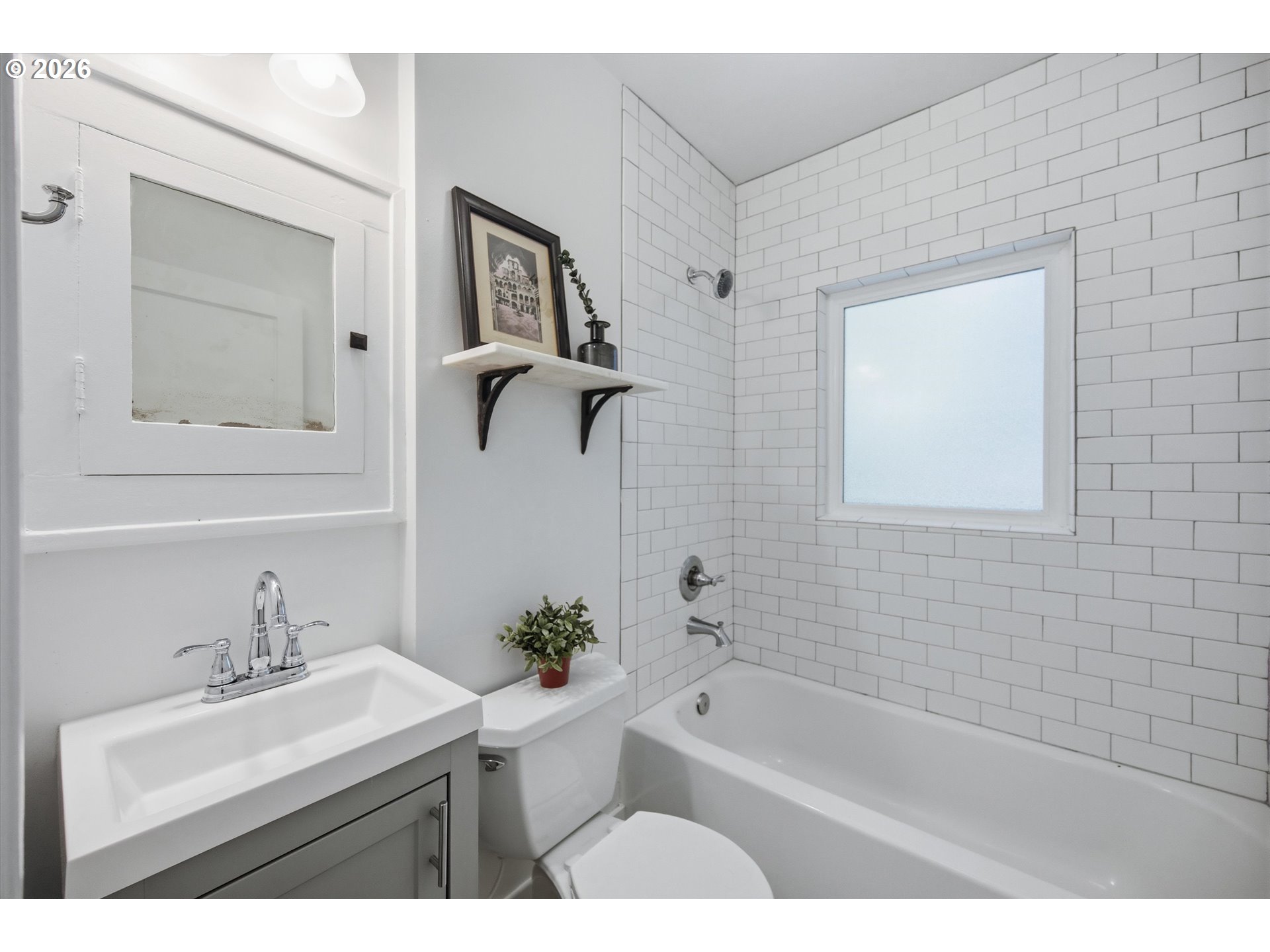 1934 Northeast 55th Avenue Portland, OR 97213 - Photo 16 of 23 a bathroom with a sink mirror toilet and bathtub