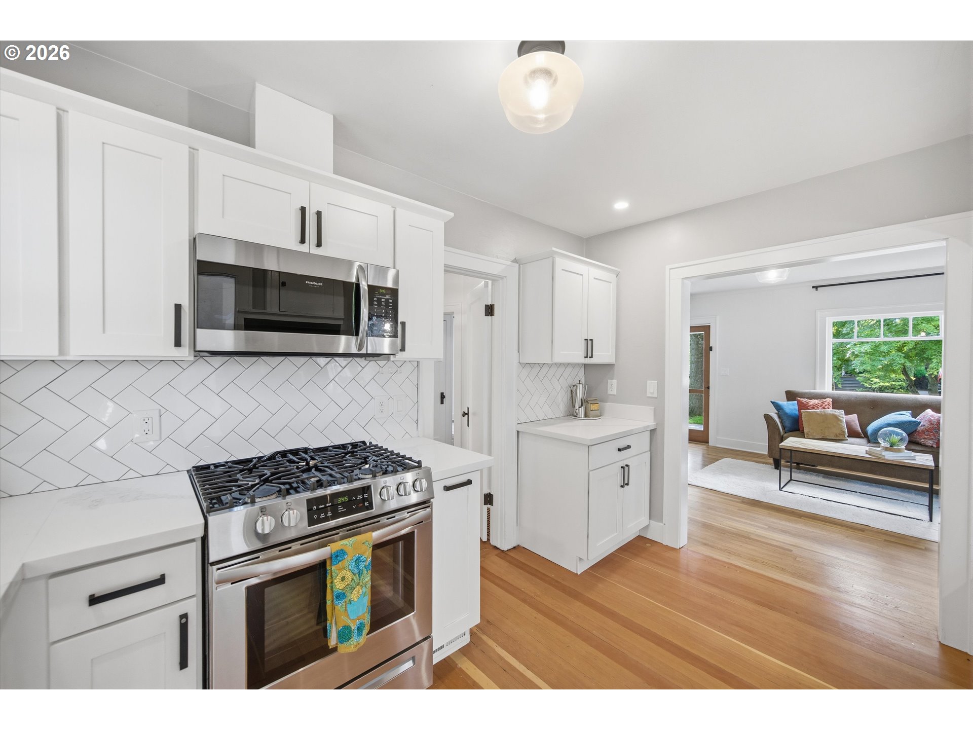 1934 Northeast 55th Avenue Portland, OR 97213 - Photo 18 of 23 a kitchen with stove cabinets and wooden floor