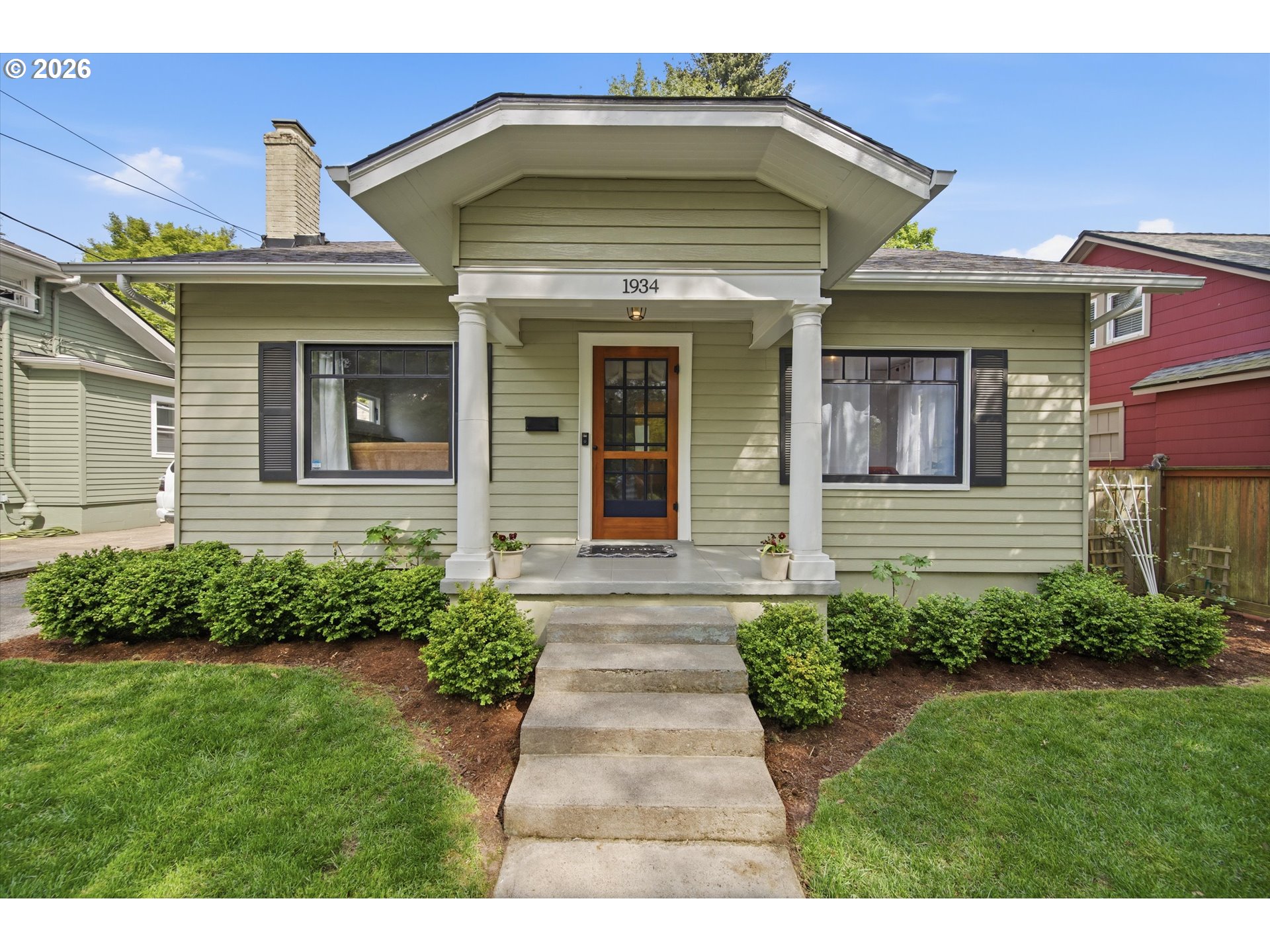 1934 Northeast 55th Avenue Portland, OR 97213 - Photo 4 of 23 a view of a house with potted plants and a yard