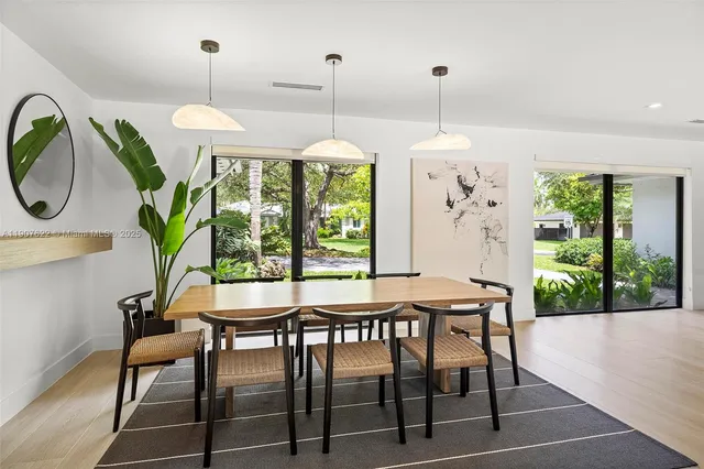 a bedroom with a bed and a large mirror