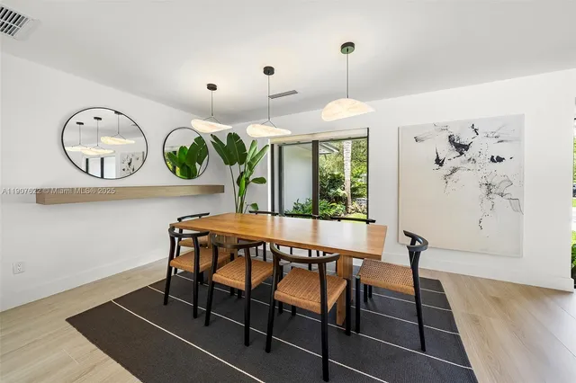 a bedroom with a large bed and a large window