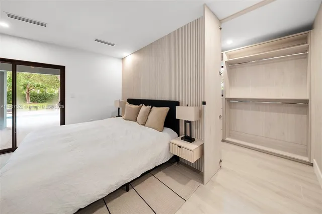 a bathroom with a sink a mirror and a shower