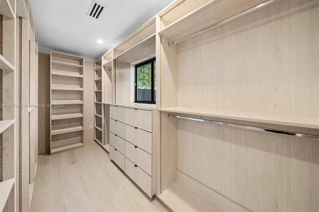 a view of a patio with a table chairs and a backyard