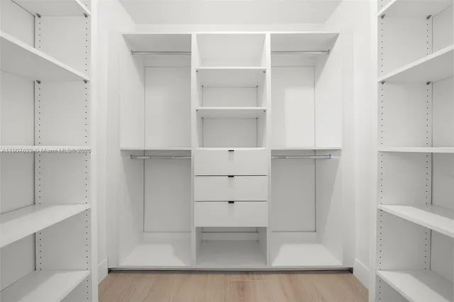 a view of a house with swimming pool and sitting area