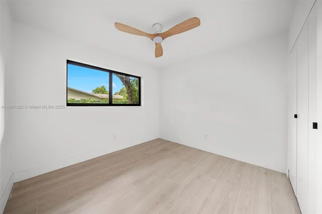 a view of a trees with a yard