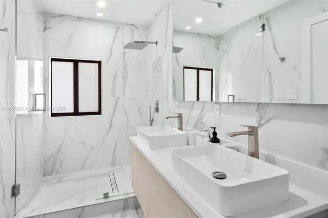 a view of a house with a yard and potted plants