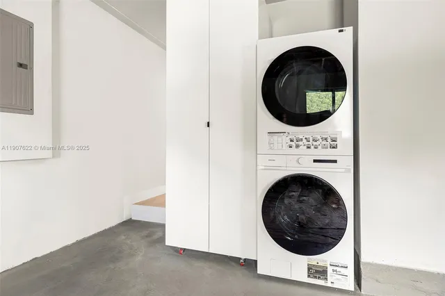 a front view of a house with a yard and a garden