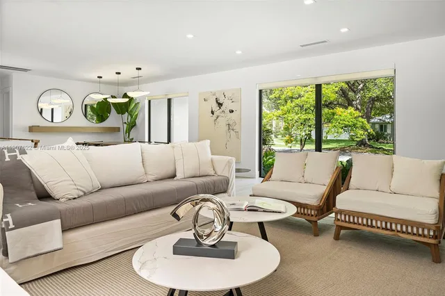 a kitchen with granite countertop a sink and stainless steel appliances