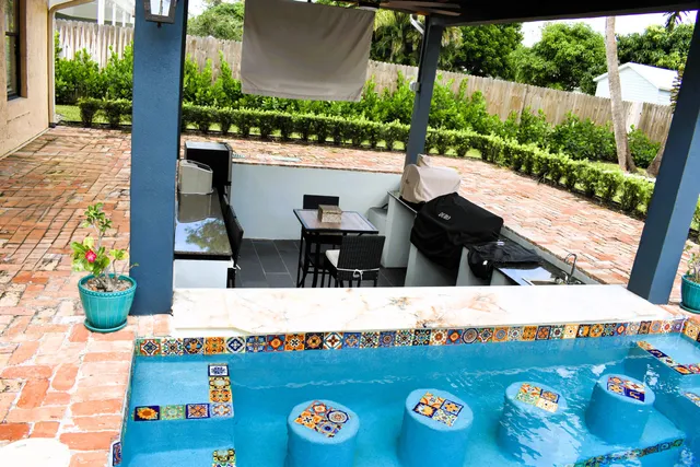 a view of living room with a table and chairs