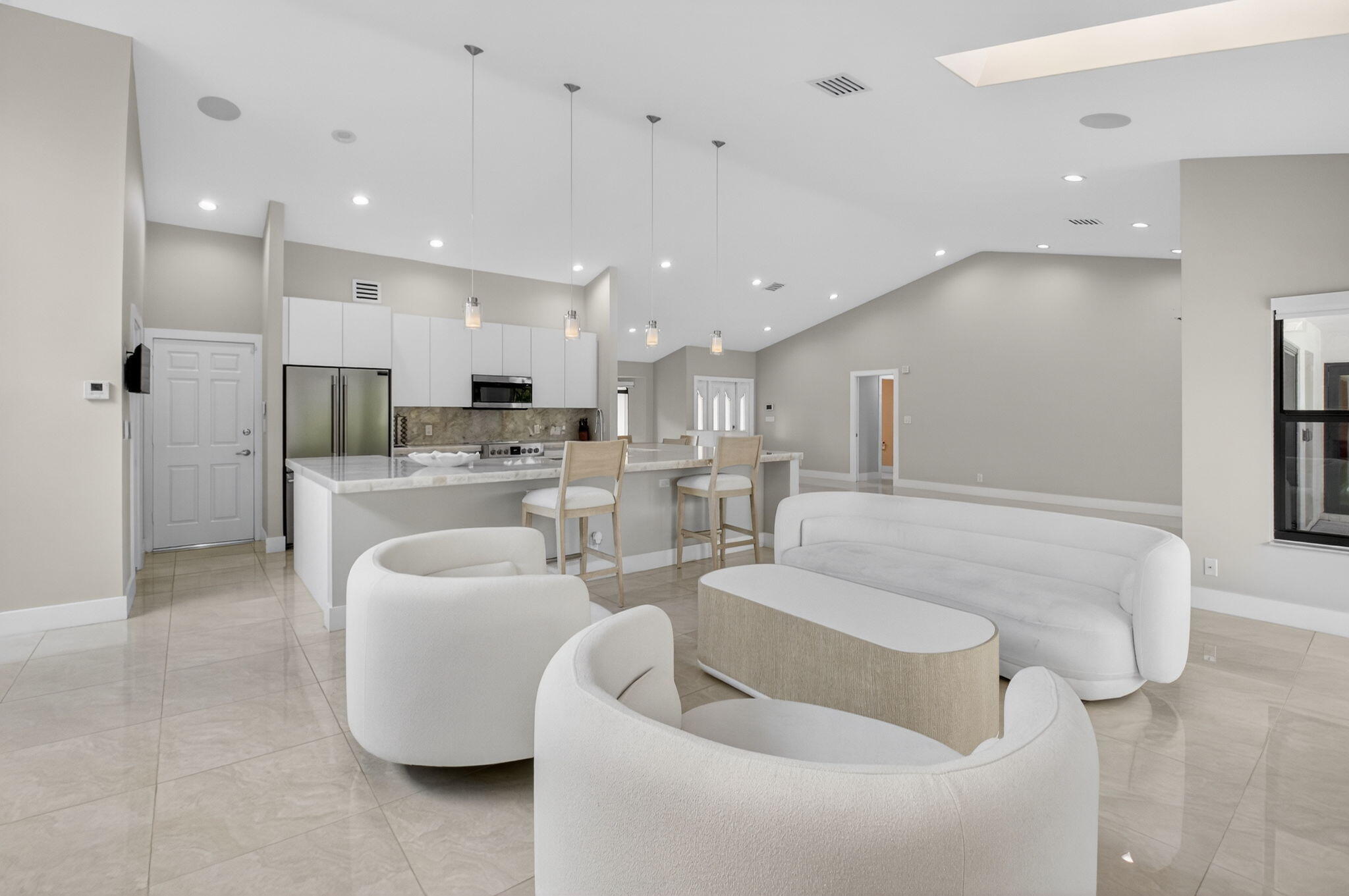 2871 Northwest 49th Street Boca Raton, FL 33434 - Photo 11 of 60 a living room with furniture and a view of kitchen