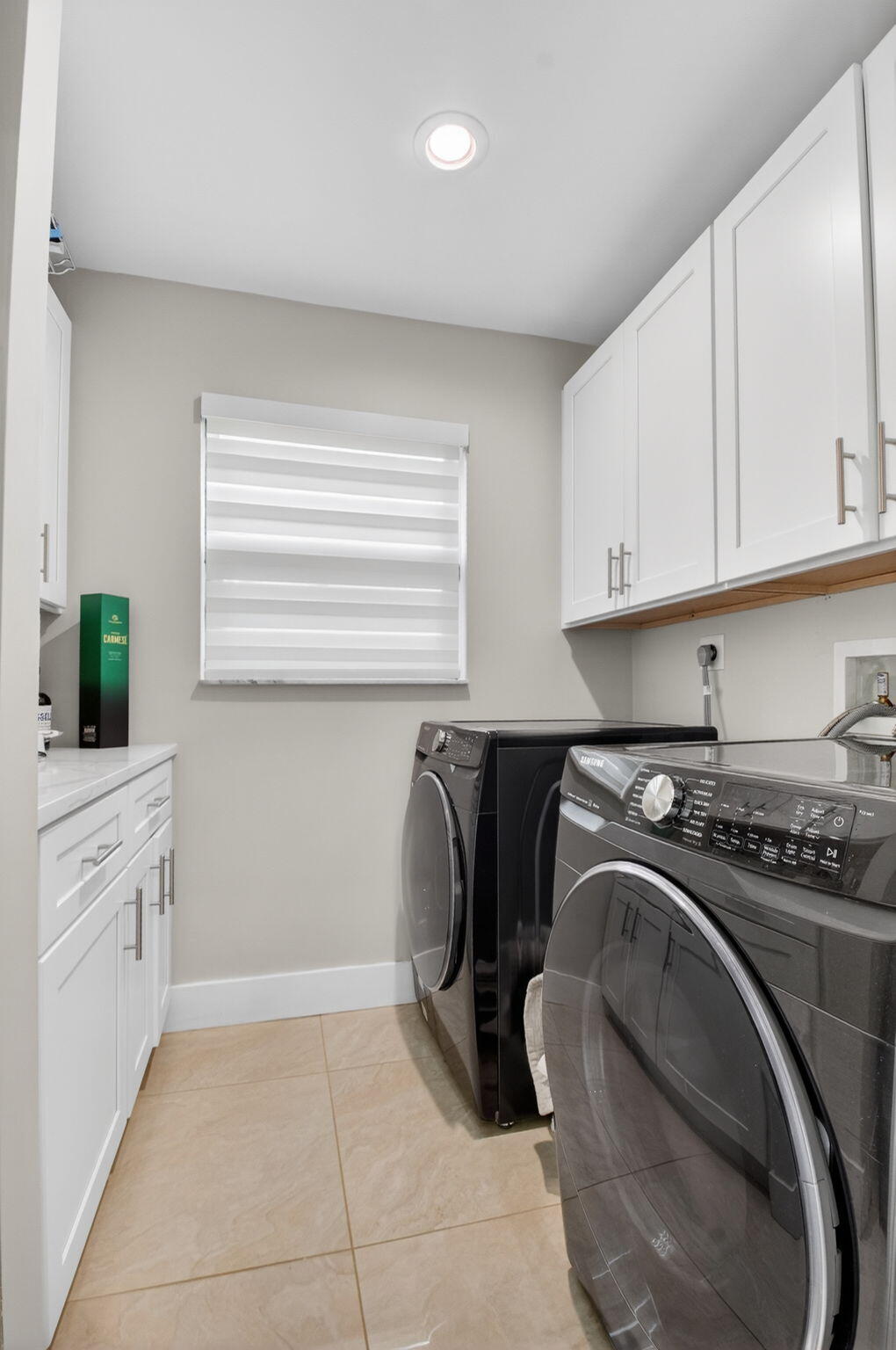 2871 Northwest 49th Street Boca Raton, FL 33434 - Photo 19 of 60 a kitchen with a sink and cabinets