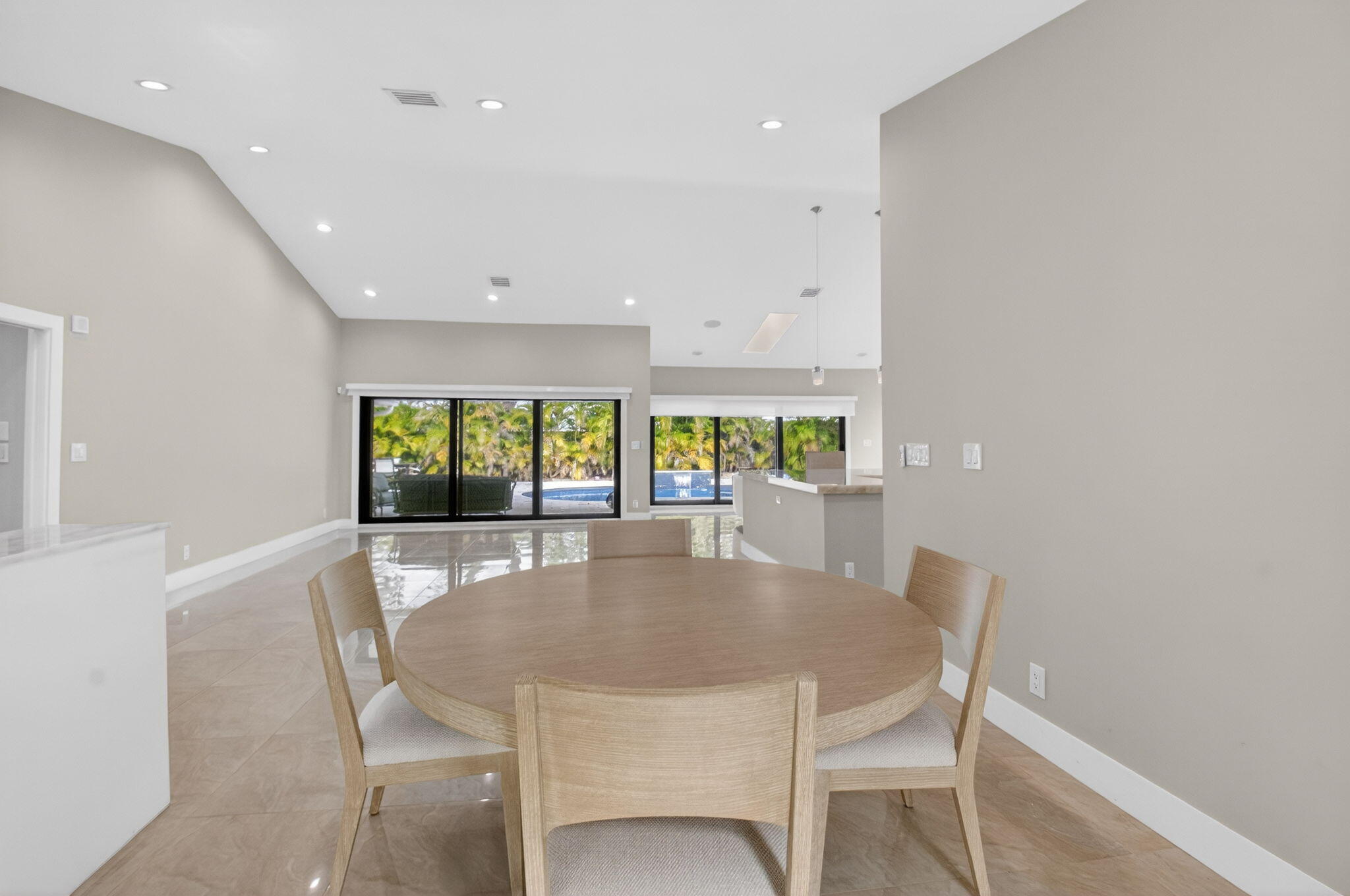 2871 Northwest 49th Street Boca Raton, FL 33434 - Photo 25 of 60 a dining room with furniture a window and outside view