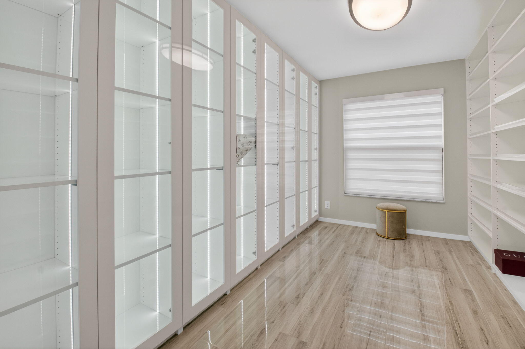 2871 Northwest 49th Street Boca Raton, FL 33434 - Photo 27 of 60 a view of an empty room with wooden floor and a window
