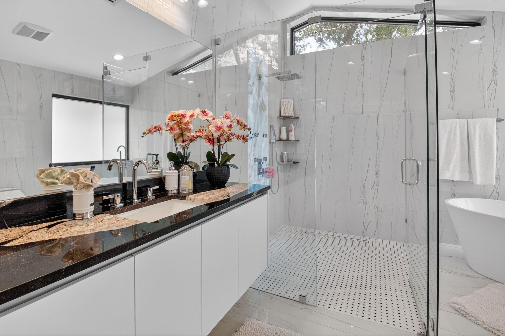 2871 Northwest 49th Street Boca Raton, FL 33434 - Photo 33 of 60 a bathroom with a double vanity sink mirror and shower