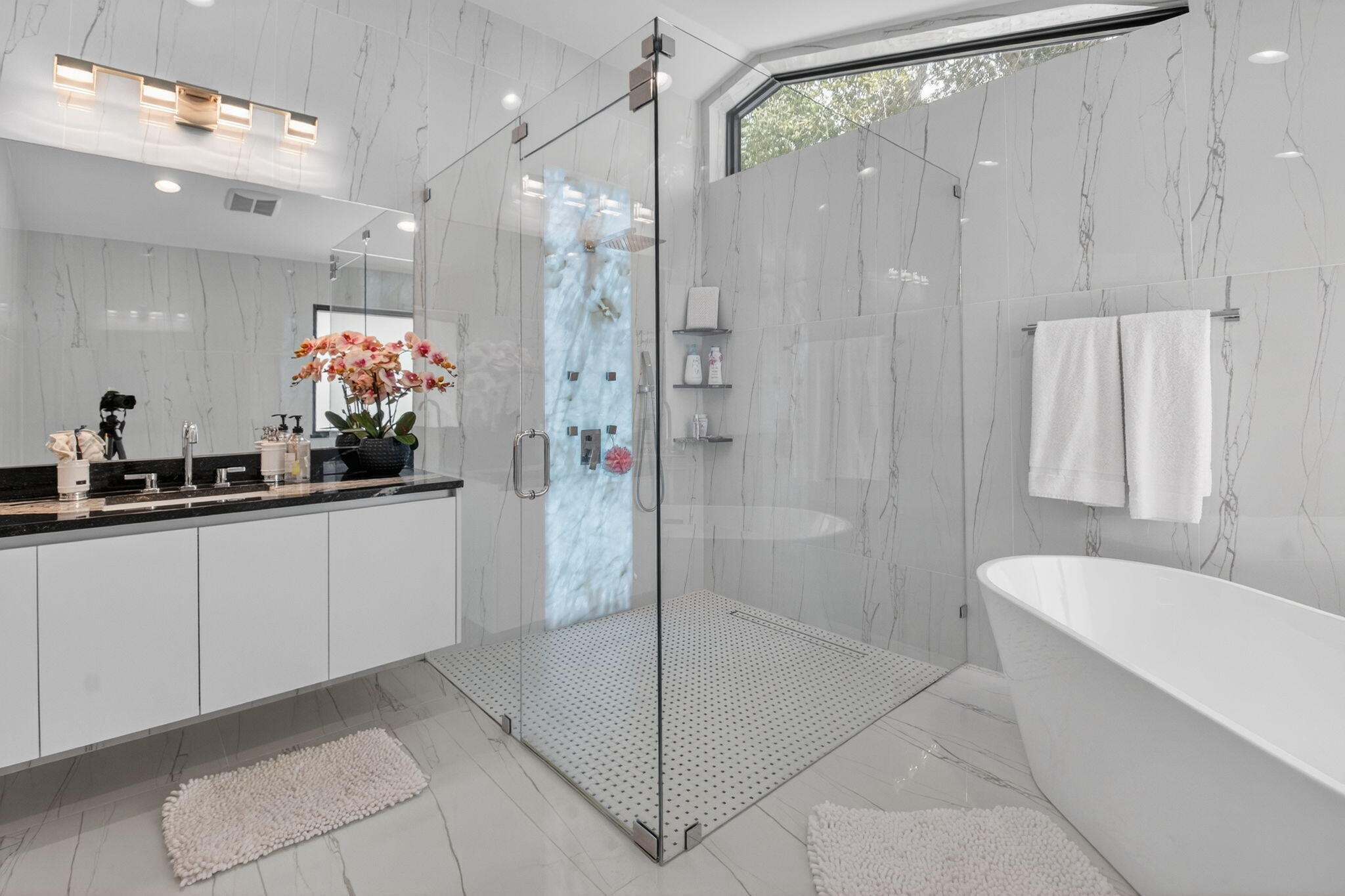 2871 Northwest 49th Street Boca Raton, FL 33434 - Photo 35 of 60 a bathroom with a shower and a sink mirror