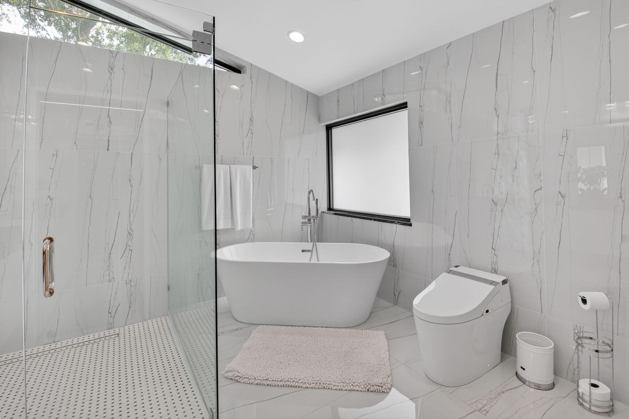 2871 Northwest 49th Street Boca Raton, FL 33434 - Photo 36 of 60 a bathroom with a toilet sink and mirror