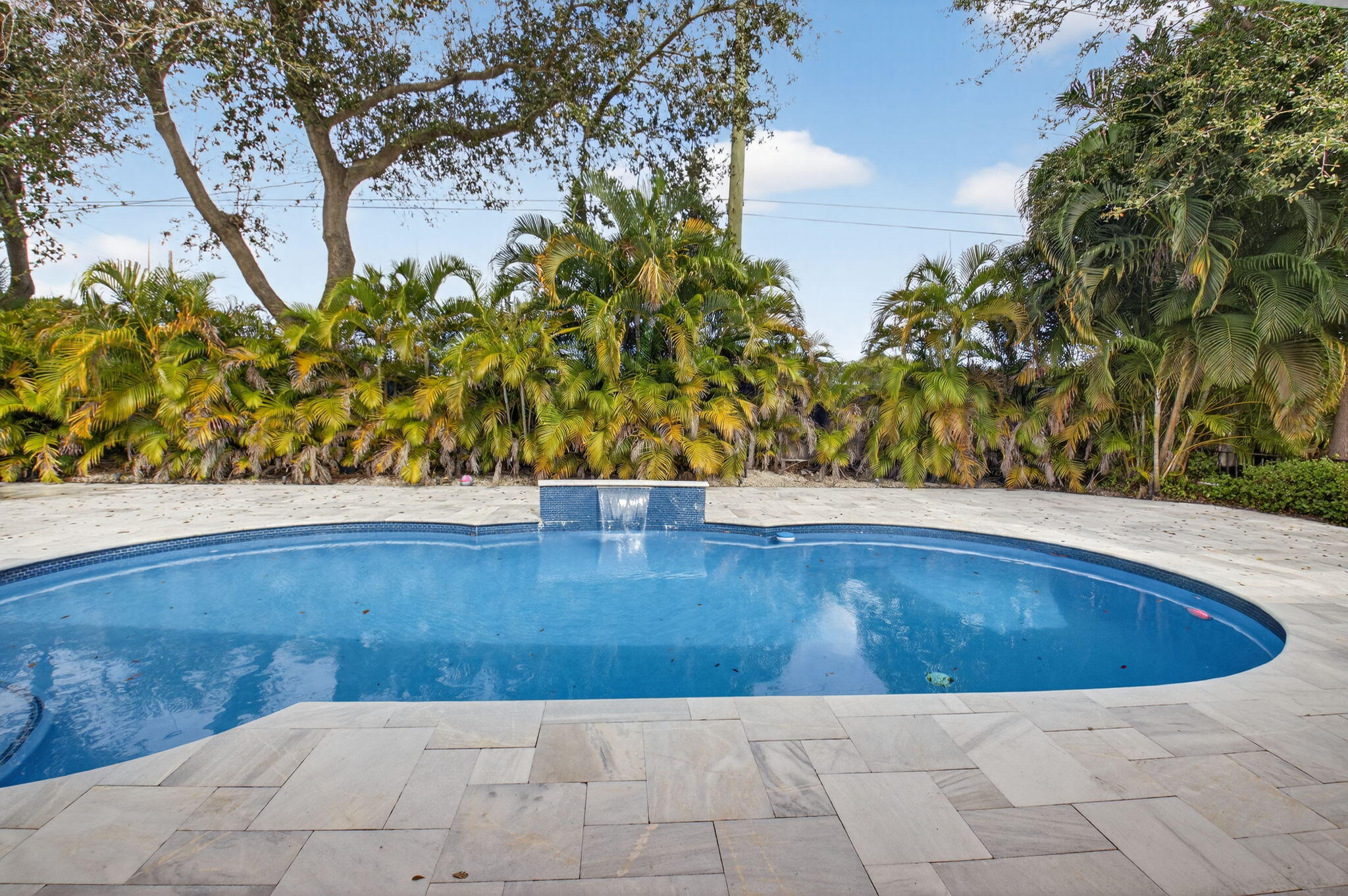 2871 Northwest 49th Street Boca Raton, FL 33434 - Photo 46 of 60 a view of swimming pool with an outdoor space