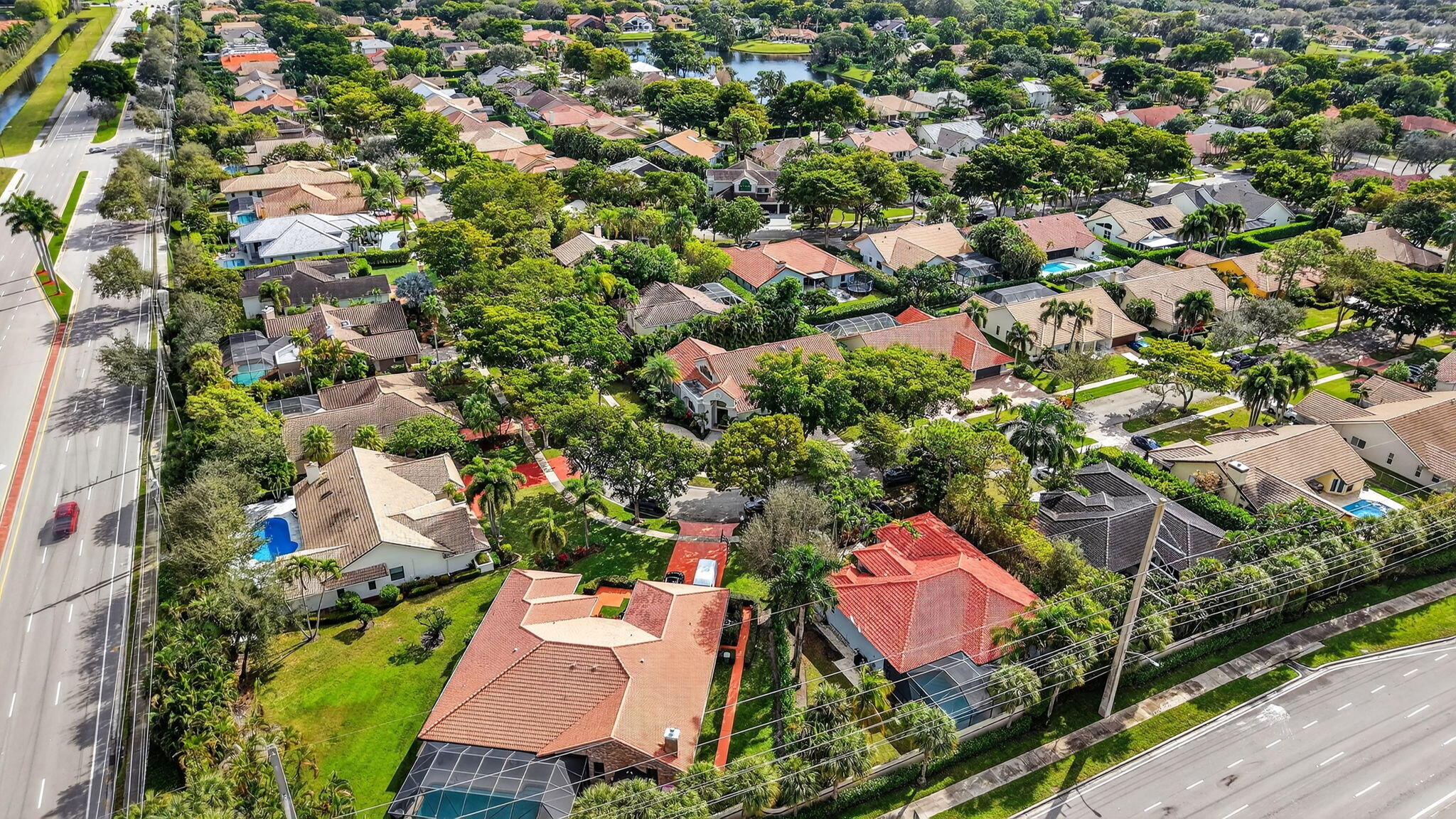 2871 Northwest 49th Street Boca Raton, FL 33434 - Photo 59 of 60 an aerial view of residential houses with outdoor space and street view