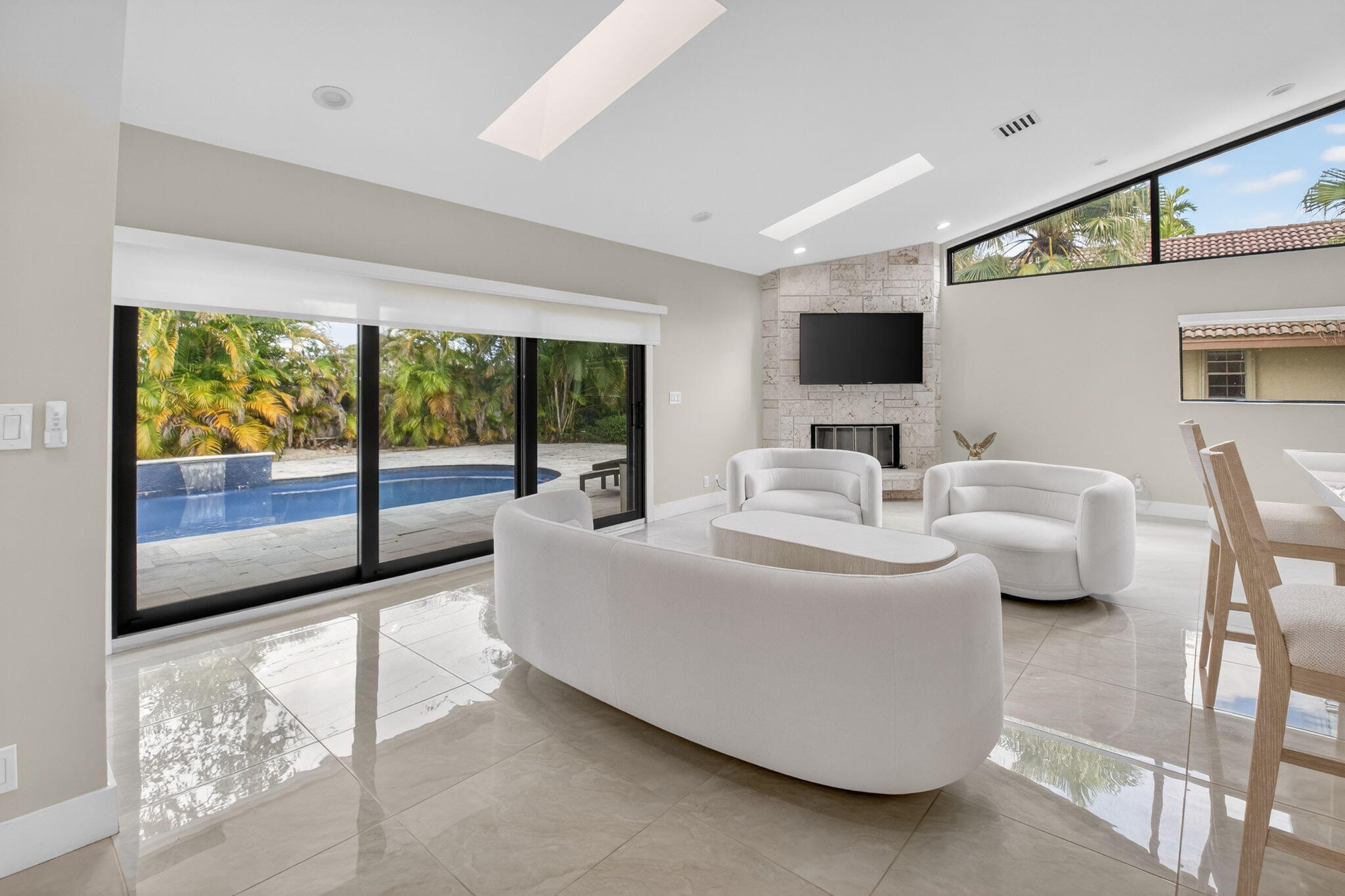2871 Northwest 49th Street Boca Raton, FL 33434 - Photo 7 of 60 a living room with furniture and large windows