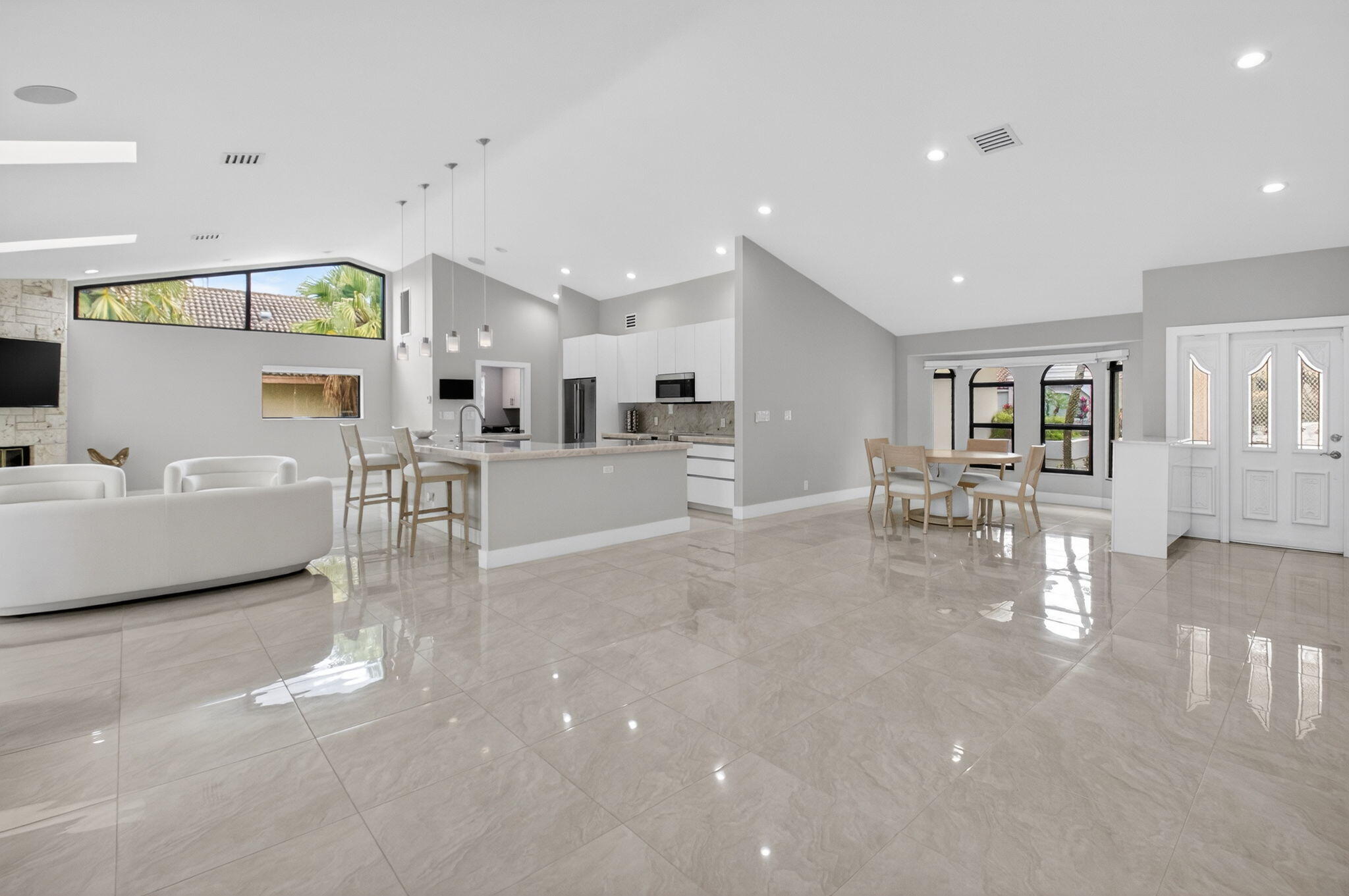 2871 Northwest 49th Street Boca Raton, FL 33434 - Photo 9 of 60 a living room with furniture and a table