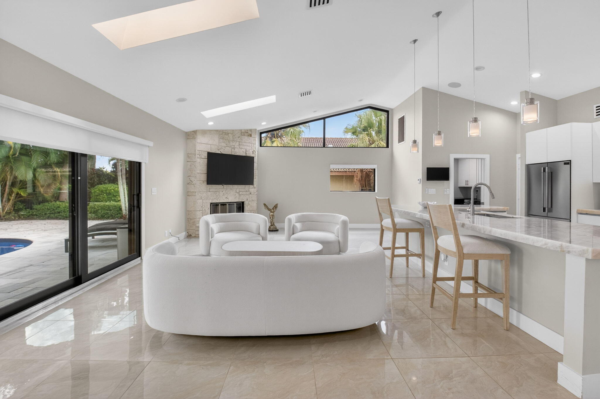 2871 Northwest 49th Street Boca Raton, FL 33434 - Photo 10 of 60 a living room with furniture and a flat screen tv