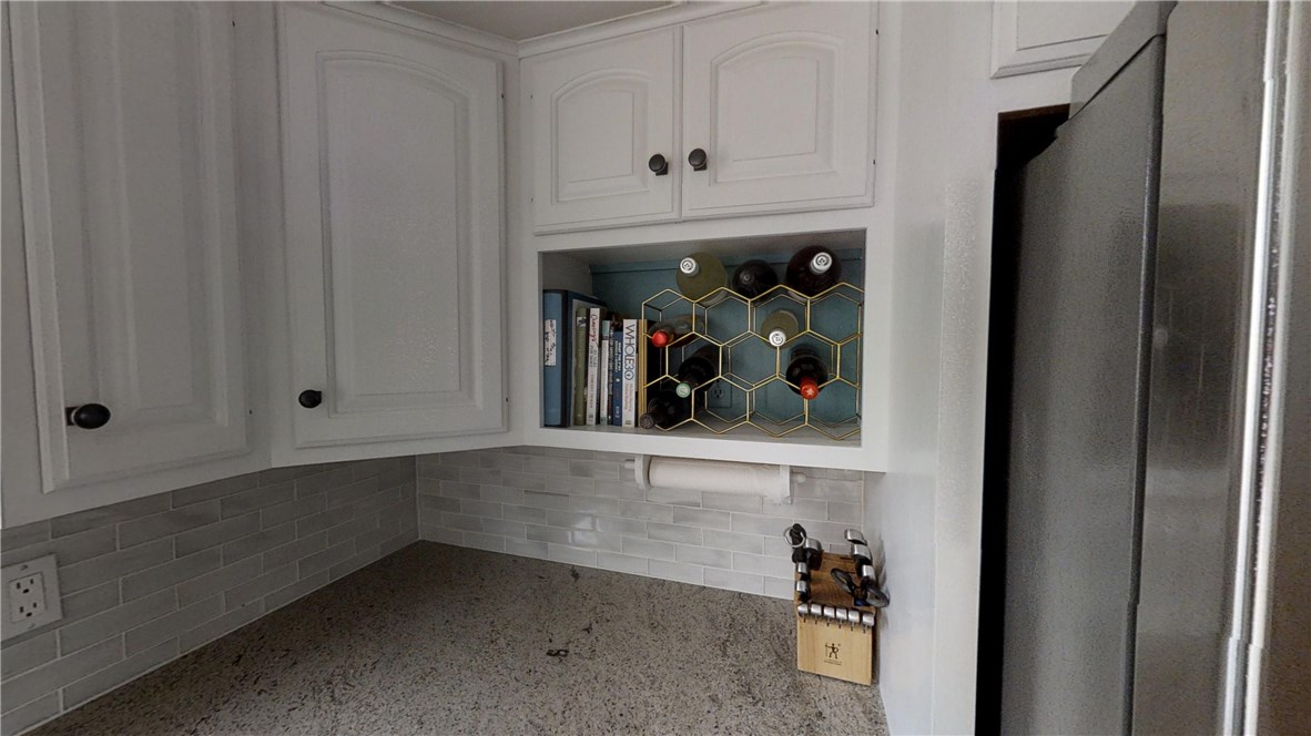5 Quail Hollow Road Cranston, RI 02920 - Photo 16 of 36 Stunning glass subway tile backsplash is brand new. Convenient nook for cookbooks and wine!