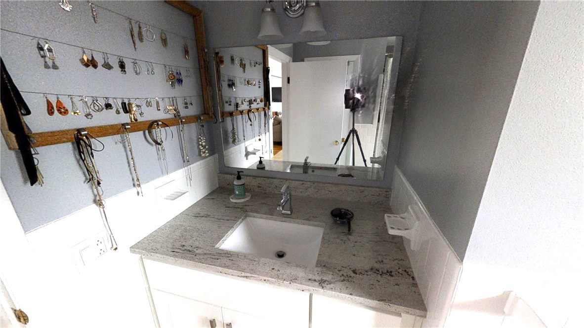 5 Quail Hollow Road Cranston, RI 02920 - Photo 29 of 36 Lots of storage in this XL vanity. Linen closet hidden behind the bathroom door.