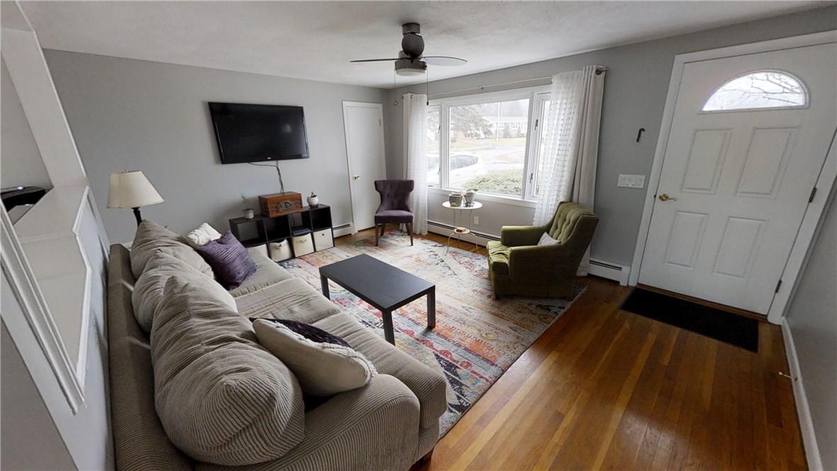 5 Quail Hollow Road Cranston, RI 02920 - Photo 7 of 36 Living room has convenient coat closet.