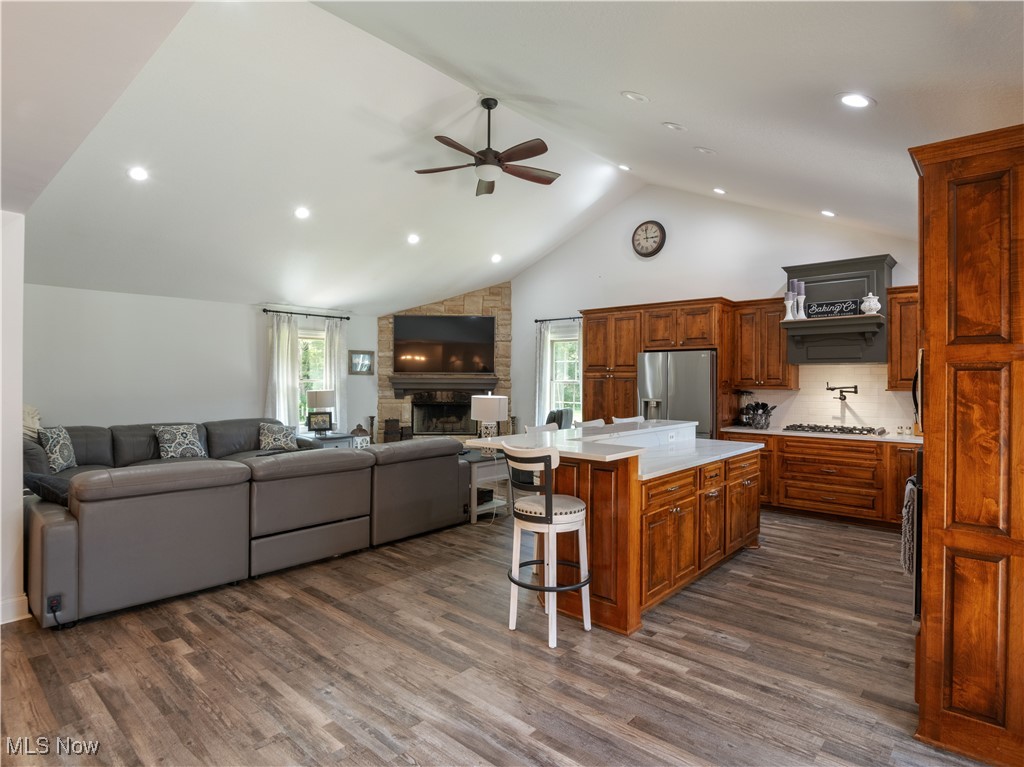 426 Bostic Road Gallipolis, OH 45631 - Photo 45 of 45 Kitchen with stainless steel refrigerator with ice dispenser, a ceiling fan, open floor plan, light countertops, and high vaulted ceiling
