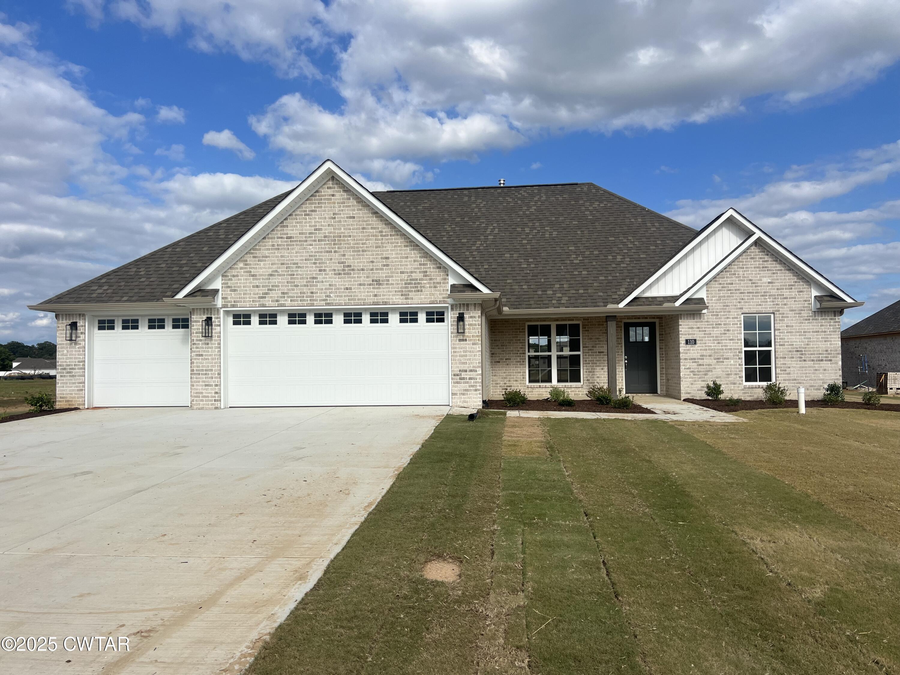 110 Daybreak Loop Medina, TN 38355 - Photo 1 of 21 a view of a house with a yard and garage