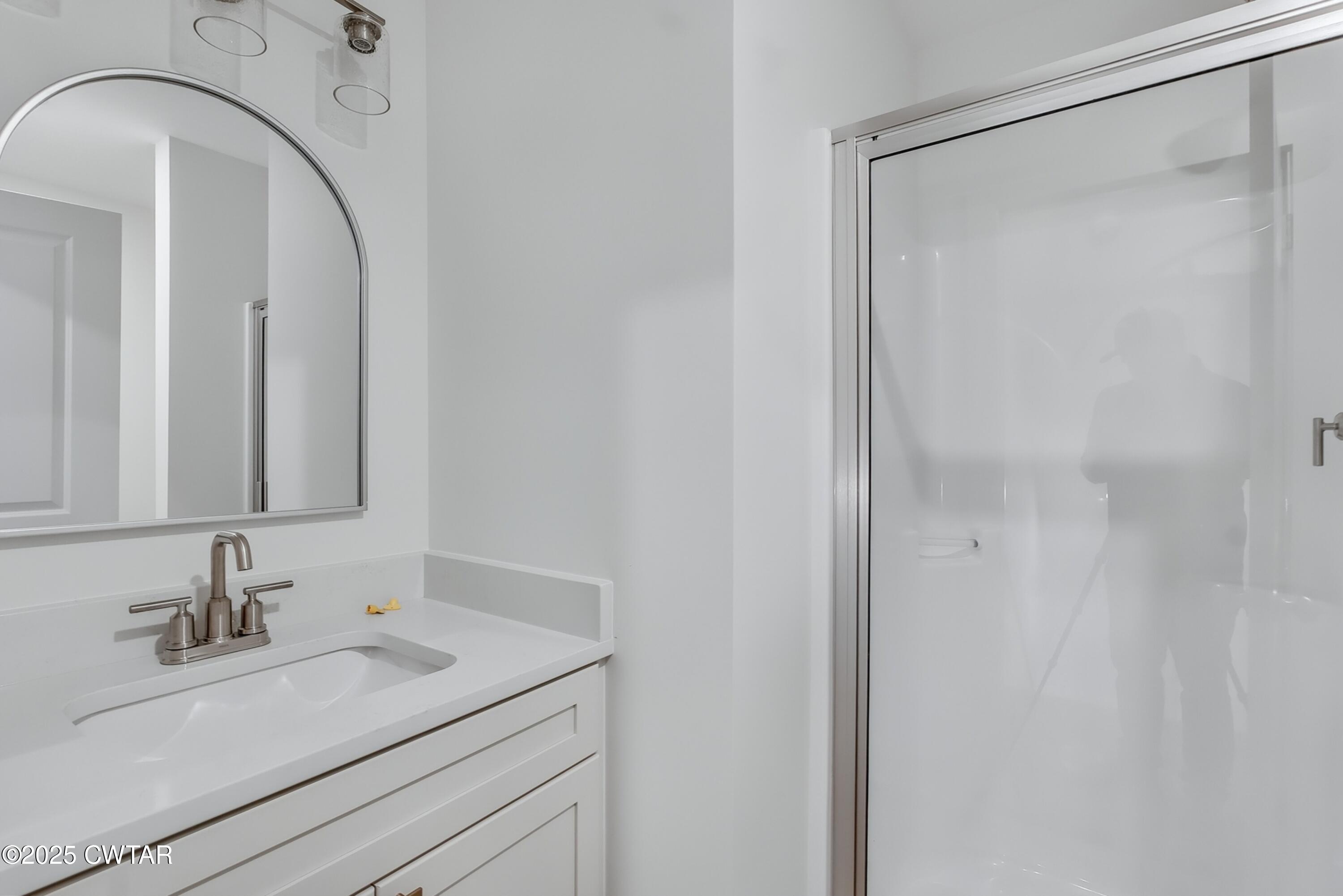 110 Daybreak Loop Medina, TN 38355 - Photo 19 of 21 a bathroom with a granite countertop sink and a mirror