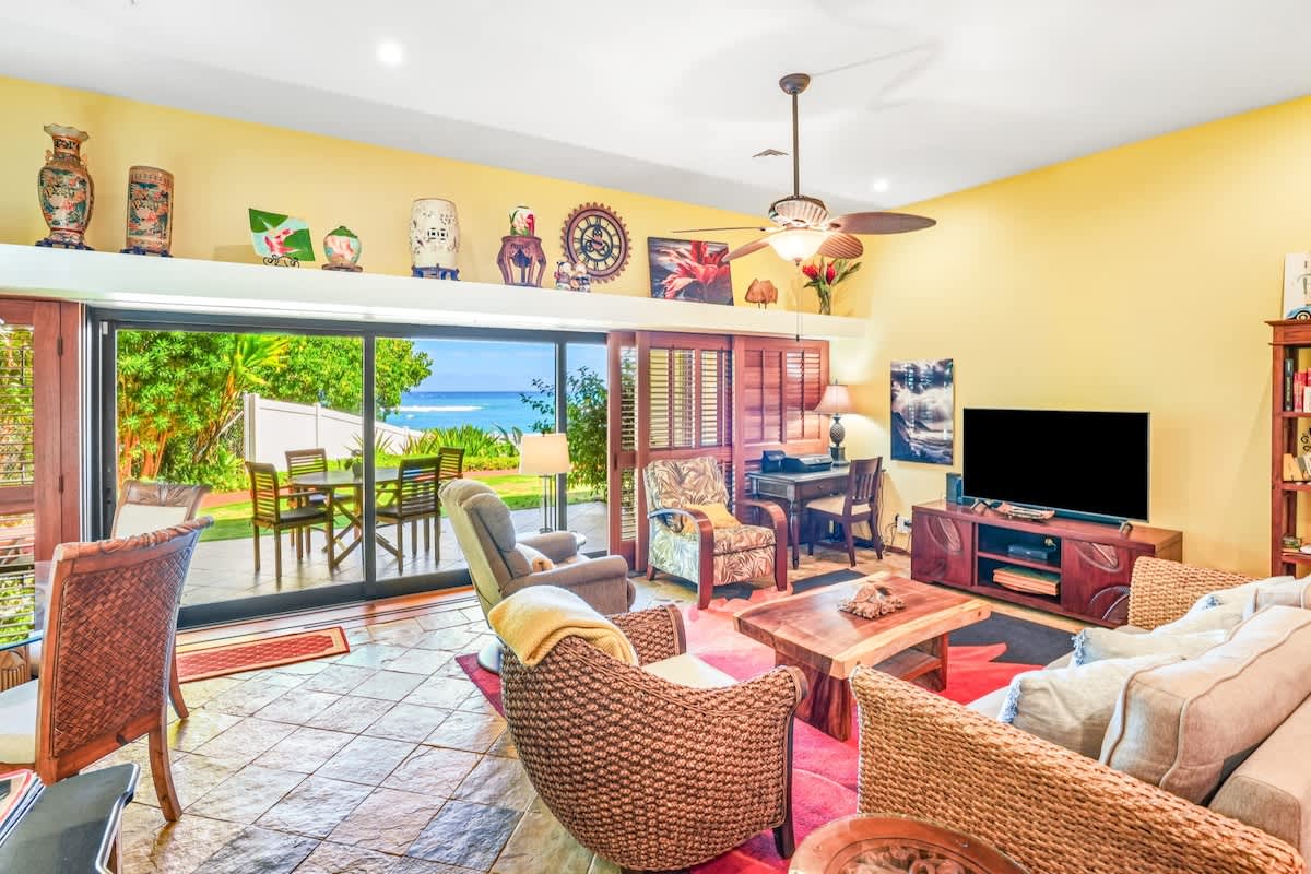a outdoor living space with furniture and a flat screen tv