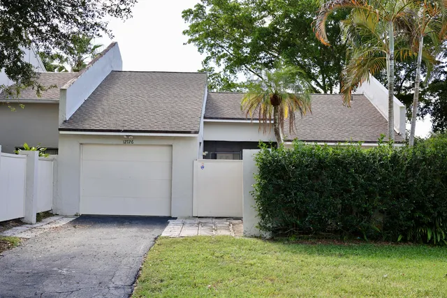 a house view with a backyard space