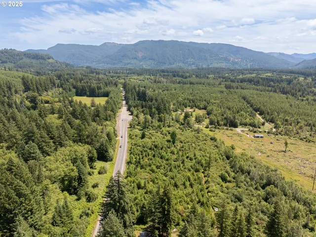 a view of a town with mountains in the background