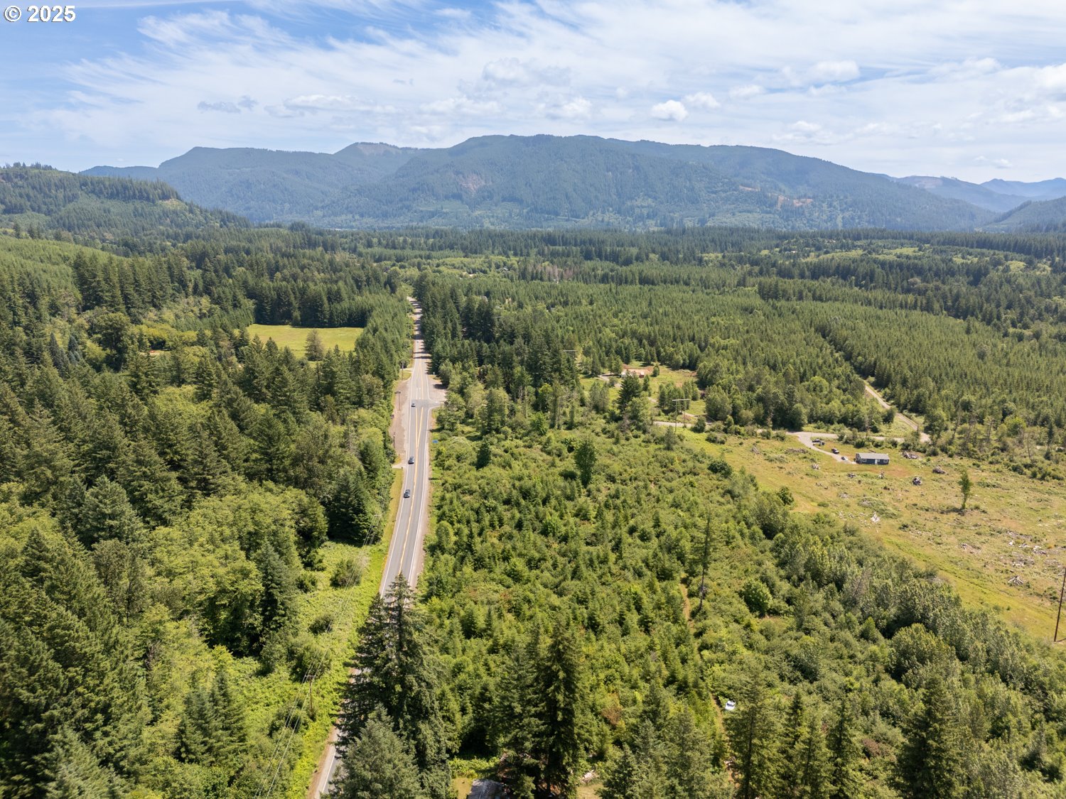 a view of a town with mountains in the background