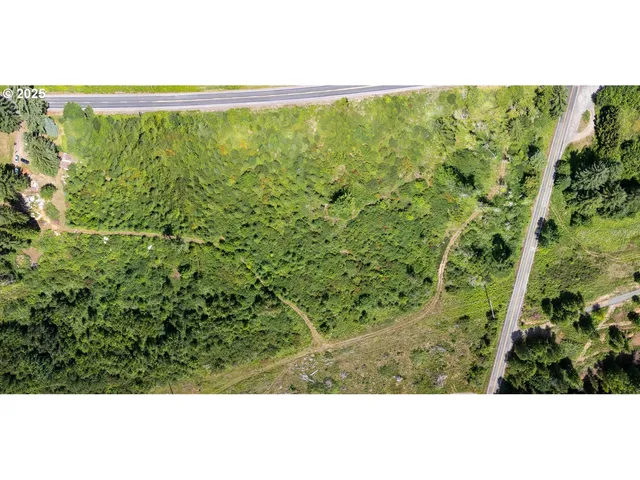 a view of a green field with an outdoor space
