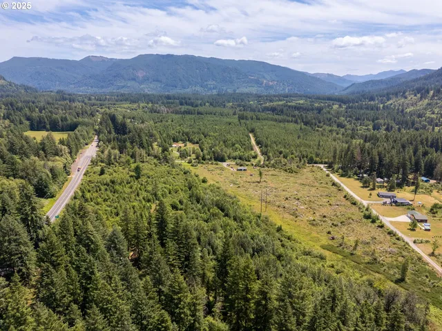 a view of a town with mountains in the background
