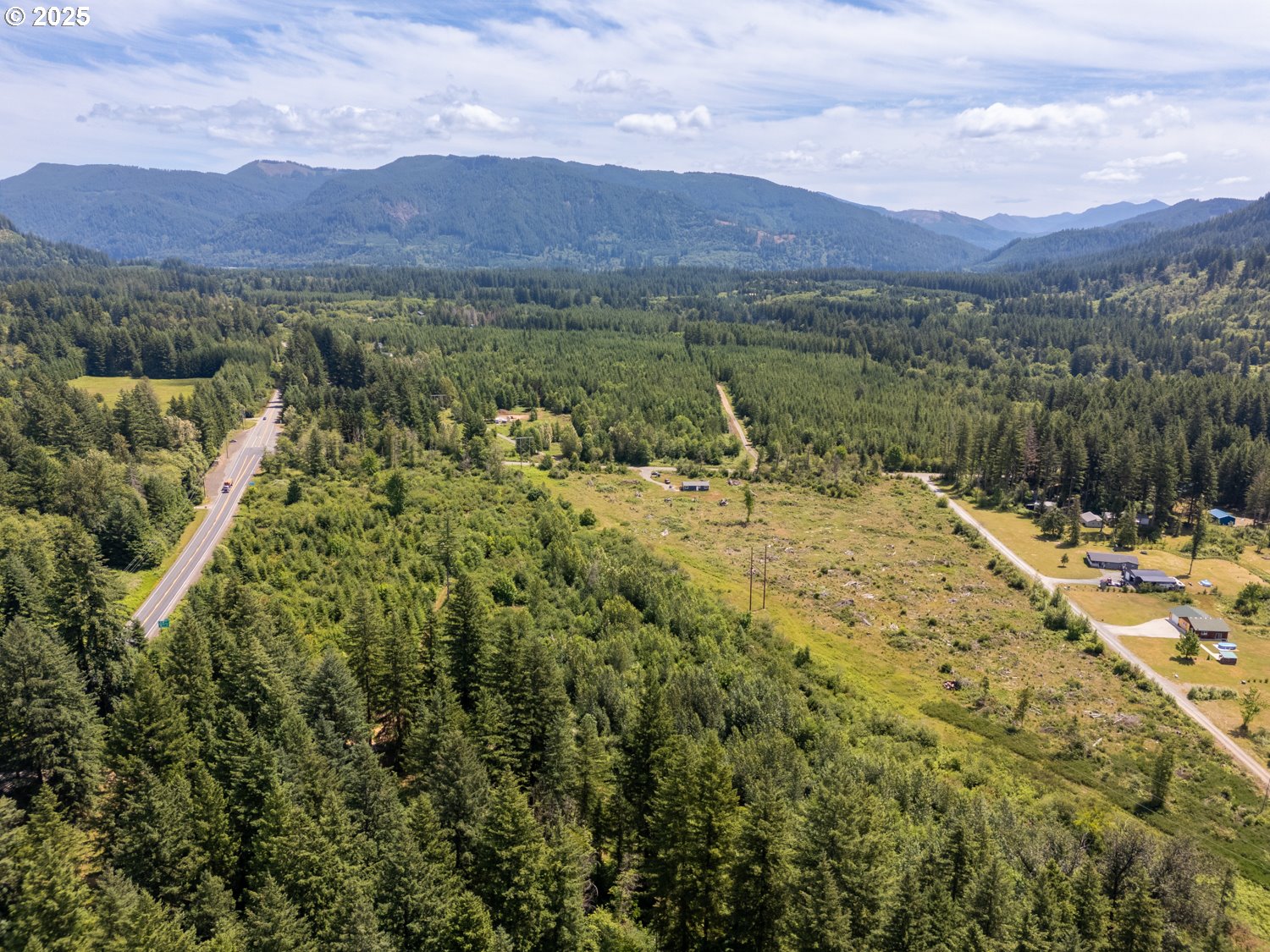 0 Lewis River Road Ariel, WA 98603 - Photo 10 of 11 a view of a town with mountains in the background