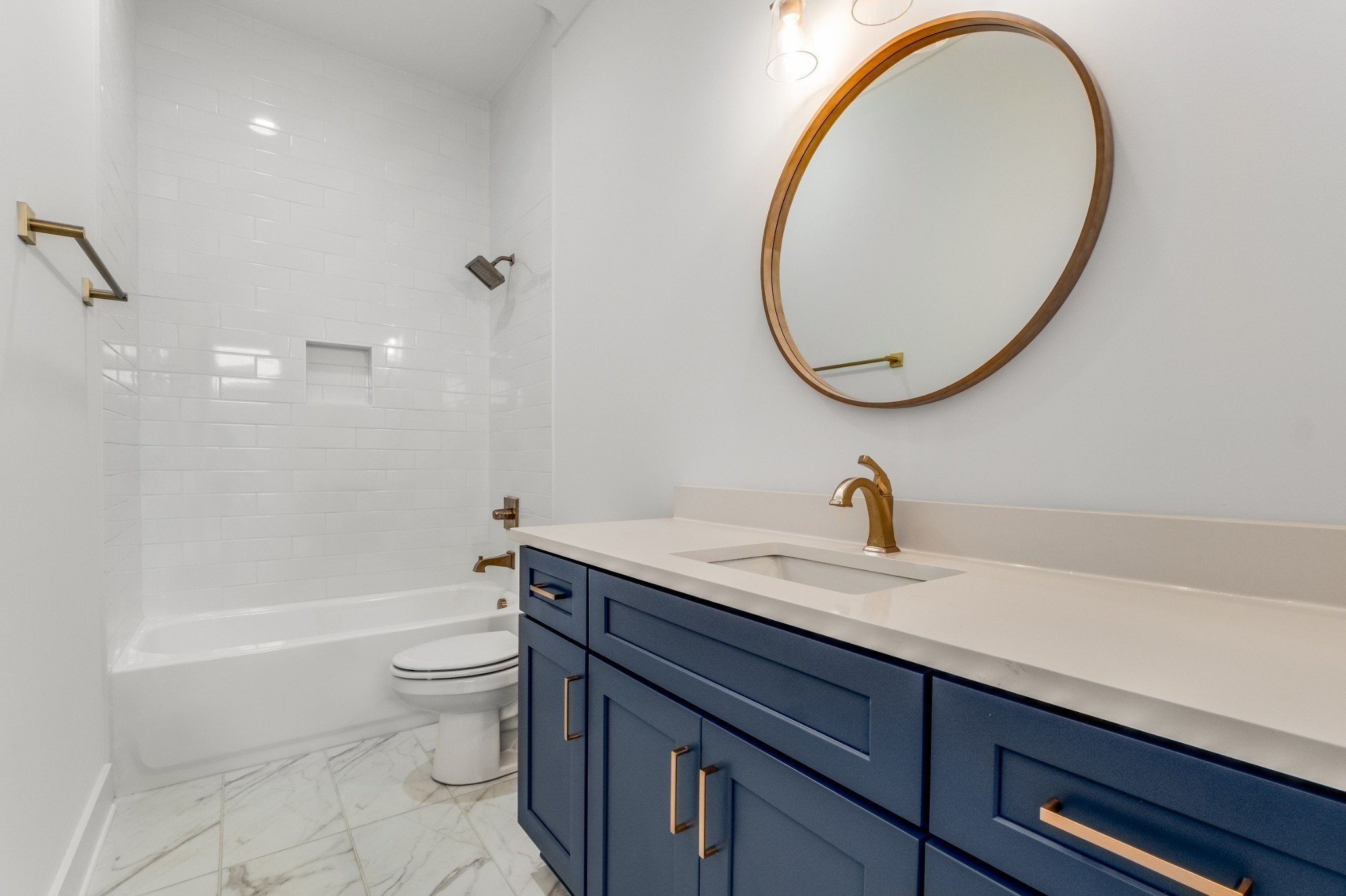 1408 Lischey Avenue, Unit C Nashville, TN 37207 - Photo 12 of 29 a bathroom with a granite countertop toilet a sink and a mirror