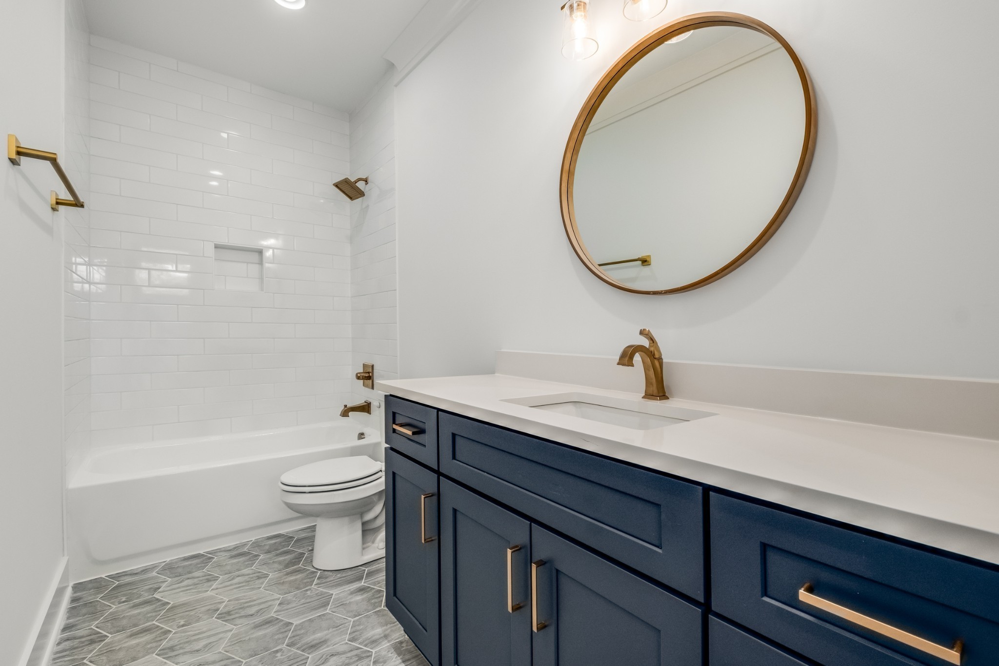 1408 Lischey Avenue, Unit C Nashville, TN 37207 - Photo 19 of 29 a bathroom with a sink a toilet and a mirror