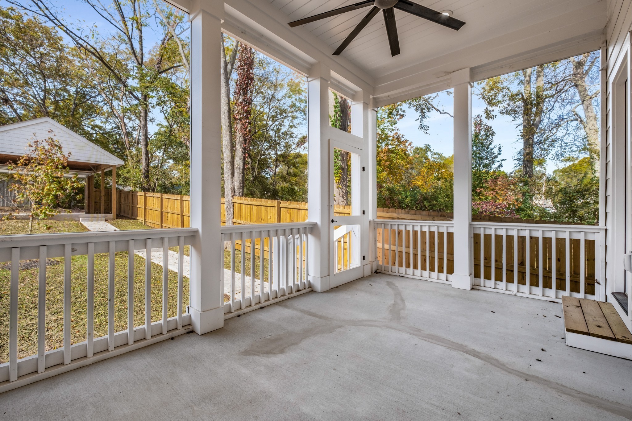 1408 Lischey Avenue, Unit C Nashville, TN 37207 - Photo 23 of 29 a view of a porch with a floor to ceiling window and a small yard